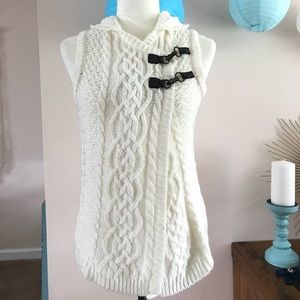 White sleeveless cardigan.